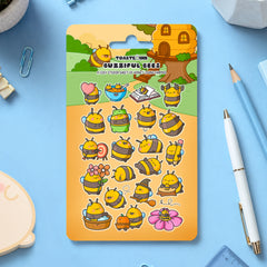 Bumblebee sticker sheet scattered with stationery around on blue table