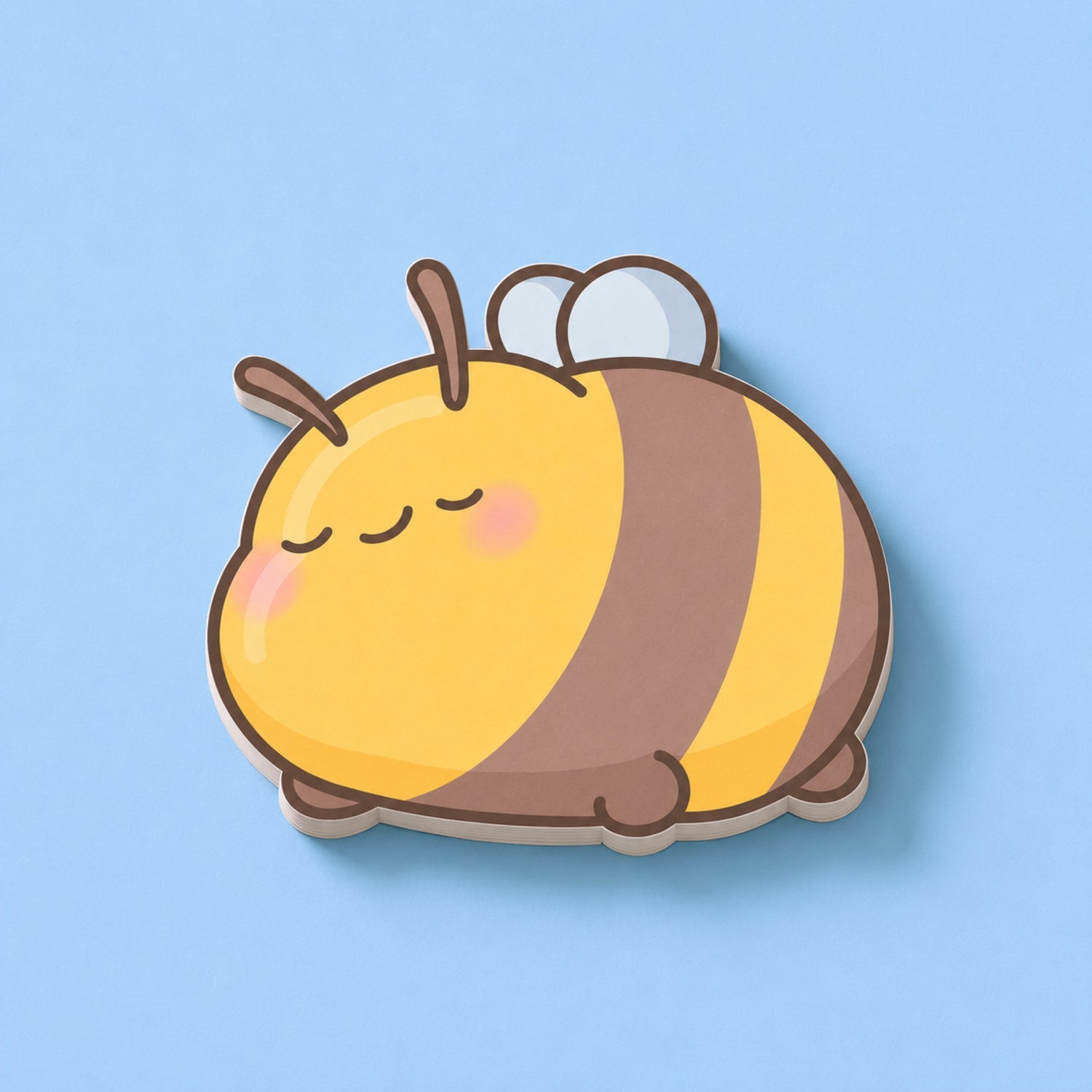 Sleeping Bee Shaped Sticky Notes on blue table