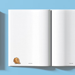 Biscuit dot grid notebook on blue table