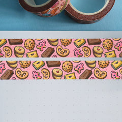 Pink biscuit washi tape on notebook and blue table
