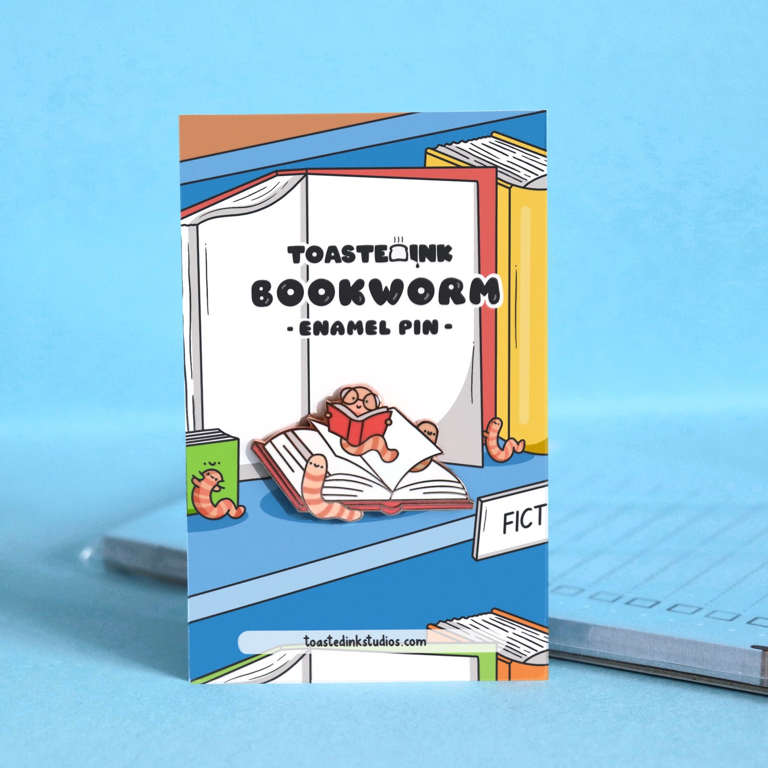 Bookworm pin on bookshelf backing card