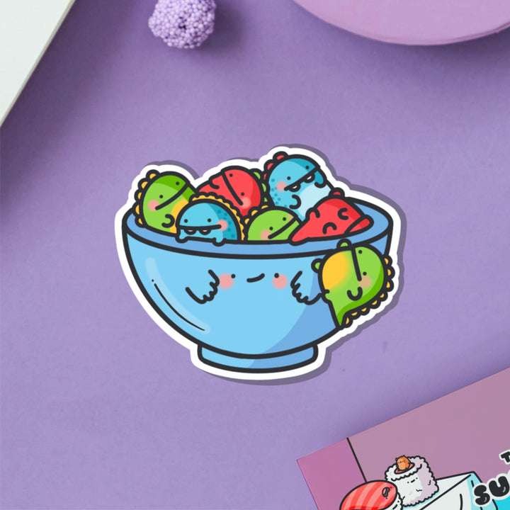 Bowl of dinosaurs vinyl sticker on purple table