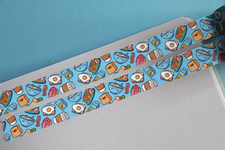 Blue breakfast washi tape on notebook rolled out