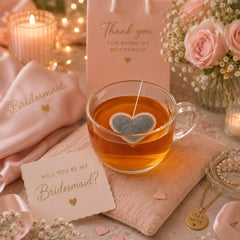 Heart shaped tea insidea mug with a tag that says 'Will you be a my bridesmaid'