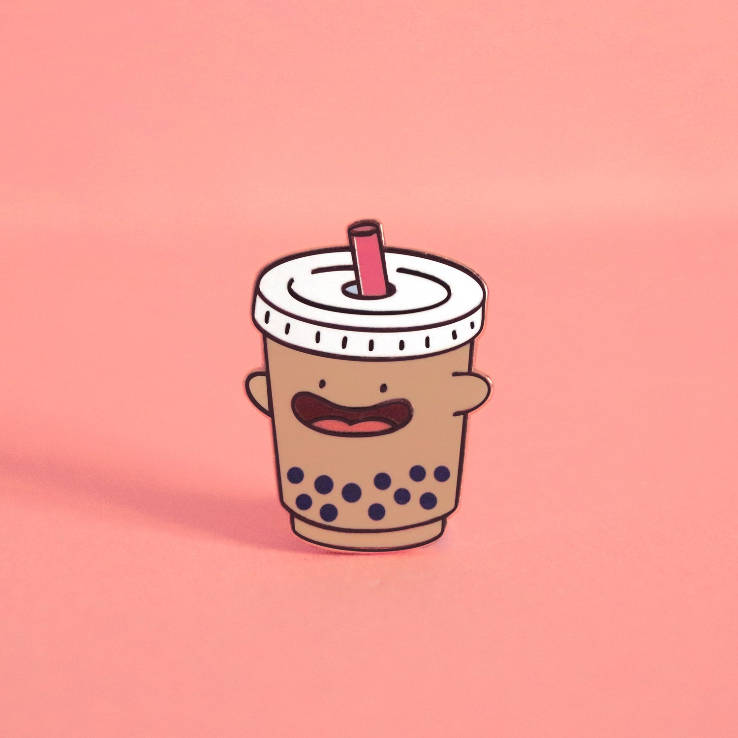 Bubble tea enamel pin on pink background