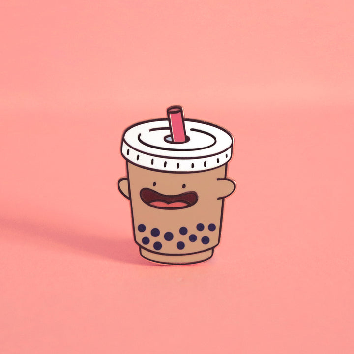 Bubble tea enamel pin on pink background