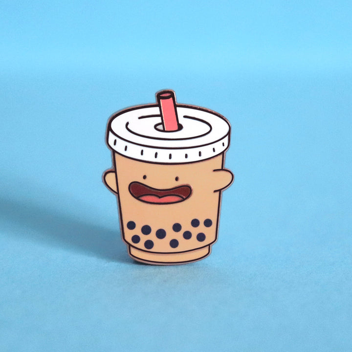 Bubble tea enamel pin on blue background