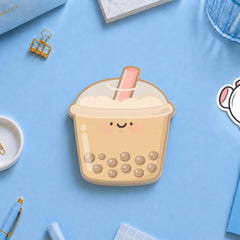 Bubble tea shaped sticky notes with stationery on blue desk