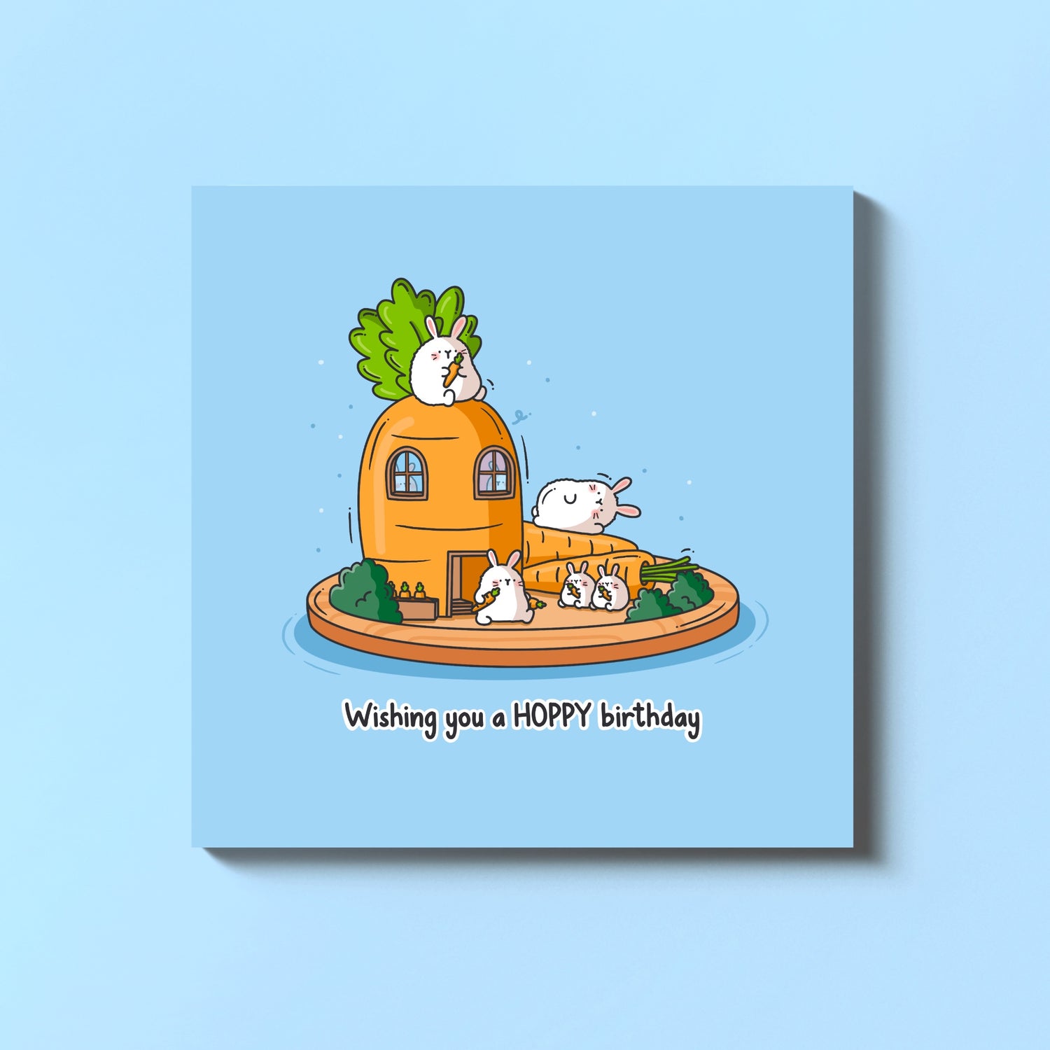 Bunny birthday card on blue table