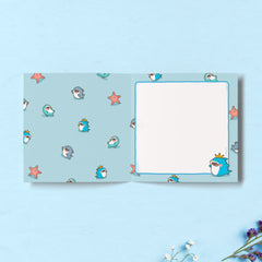 Shark print inside card on blue table