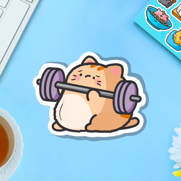 Cat lifting weights vinyl sticker on blue table
