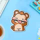 Cheeky monkey vinyl sticker on blue table