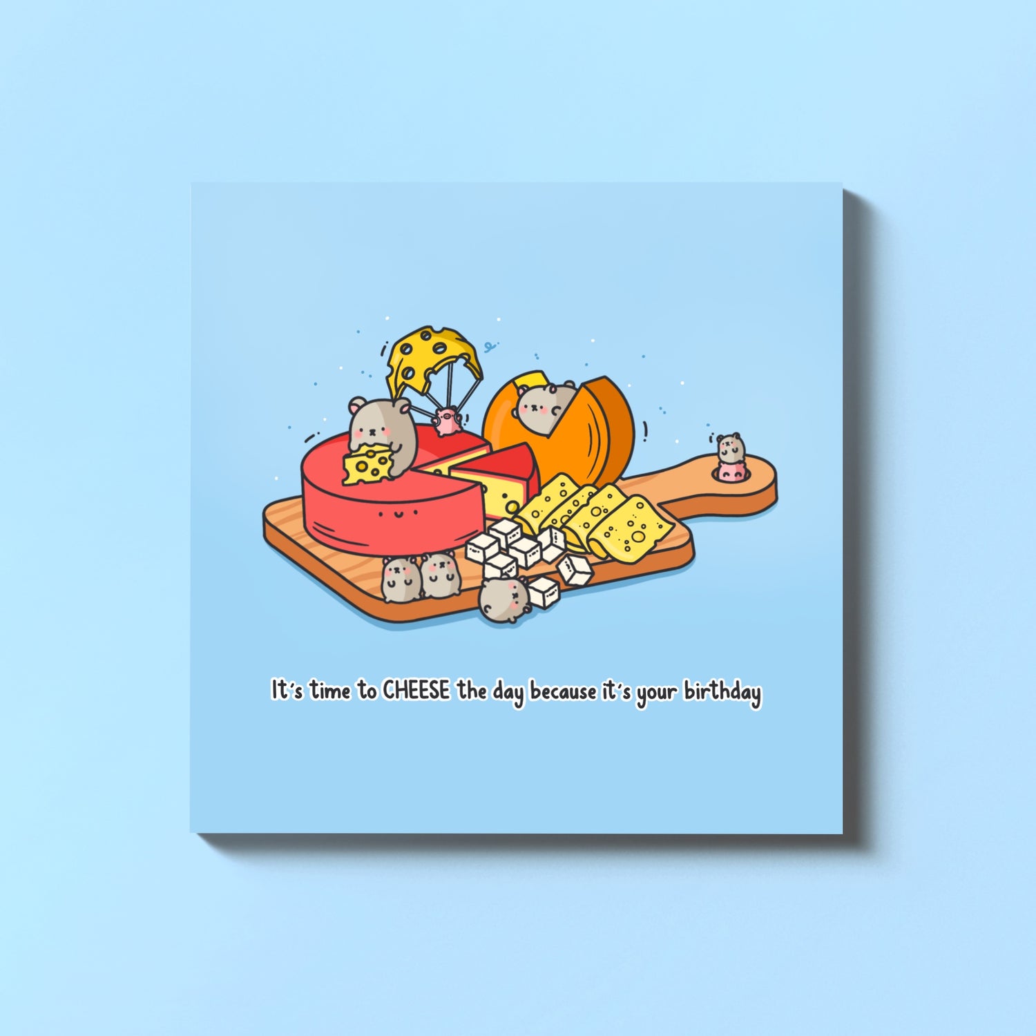 Cheese board birthday card on blue table
