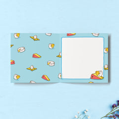 Cheese print inside card on blue table