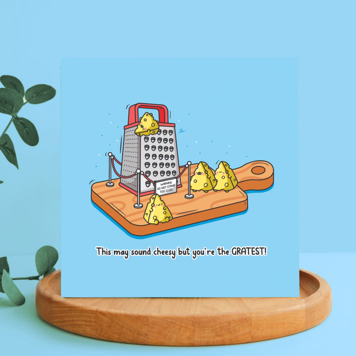 Cheese grater card on wooden block