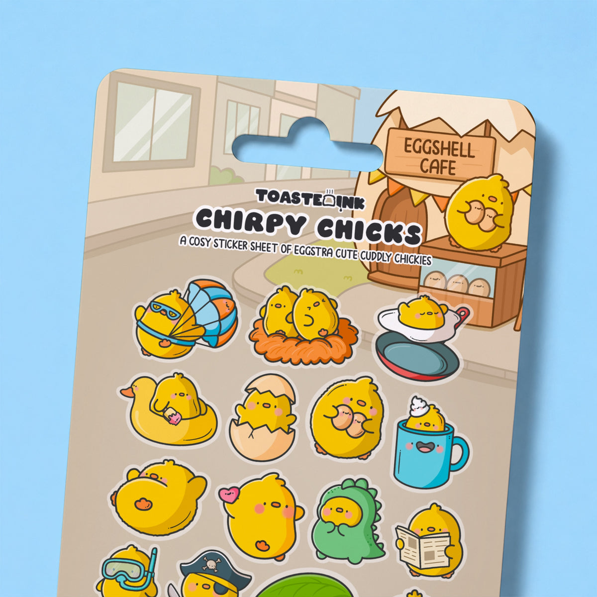Close up of chick sticker sheet on blue desk