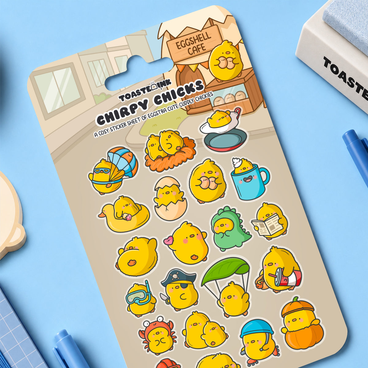 Chick sticker sheet on blue table with stationery