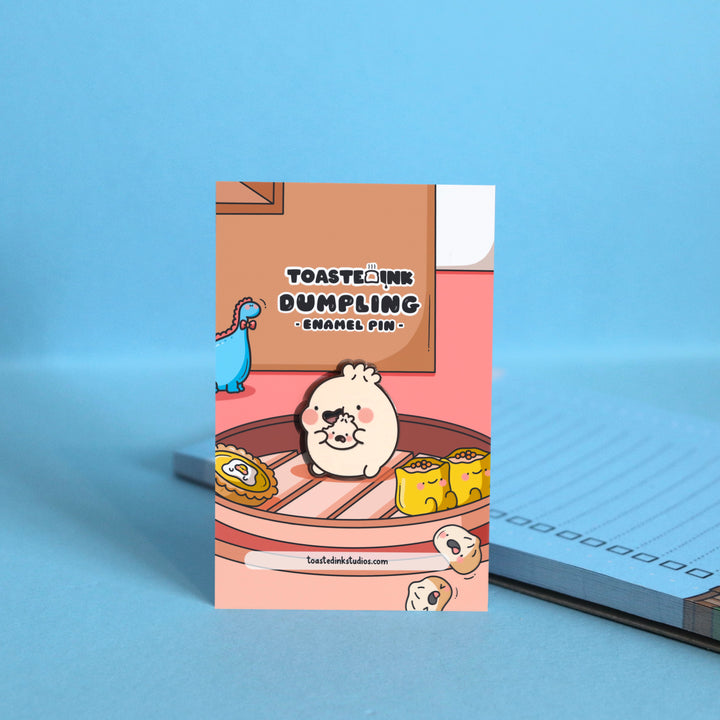 Dumpling eating enamel pin on dim sum boat backing card