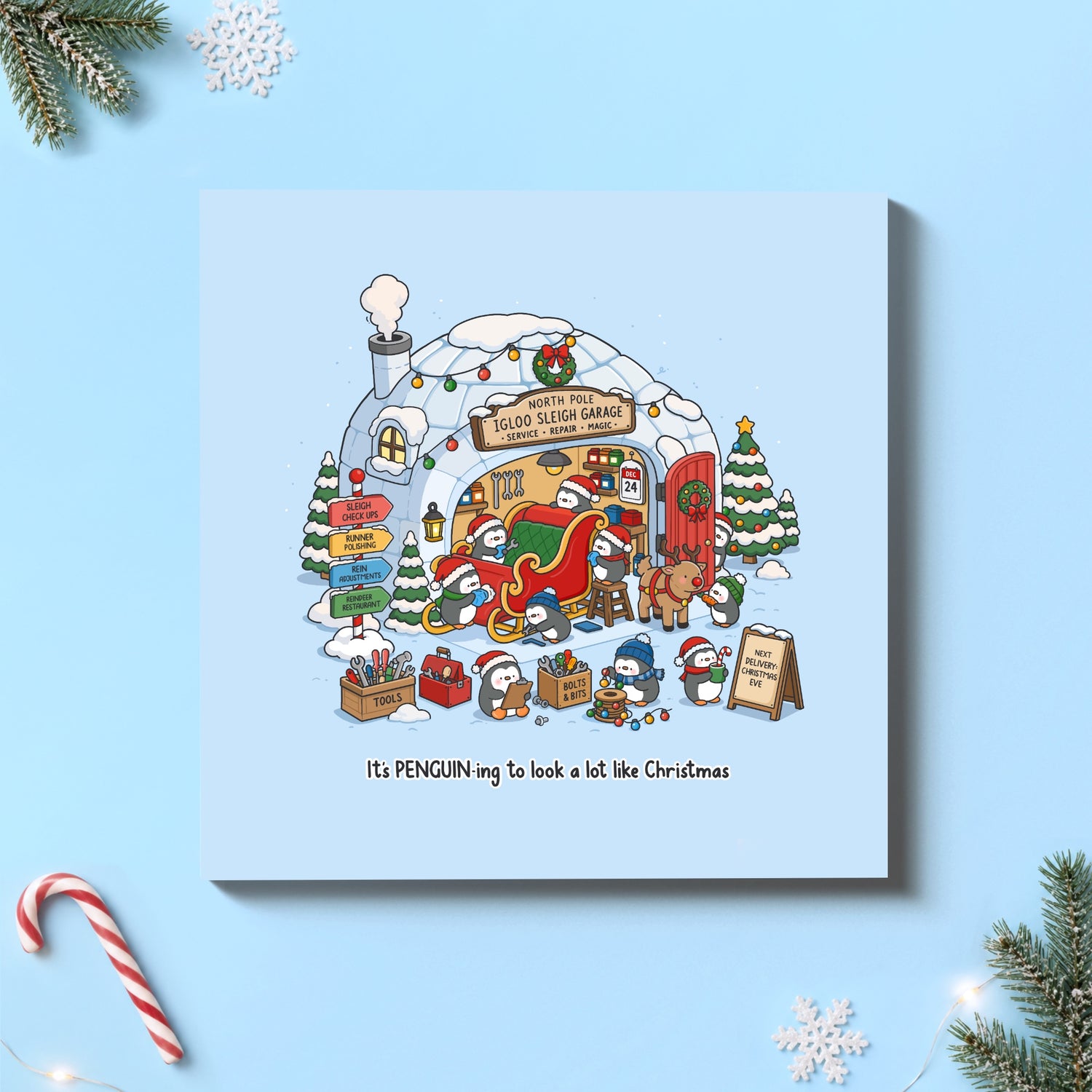 Christmas penguin card on blue background