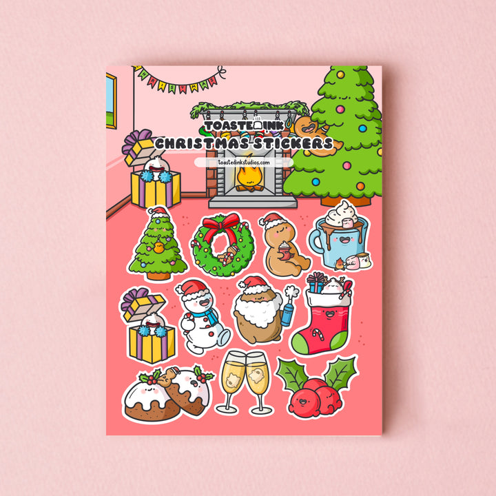 Christmas sticker sheet on pink table