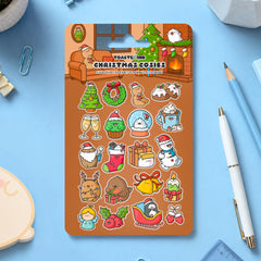 Christmas sticker sheet on blue desk with stationery scattered around