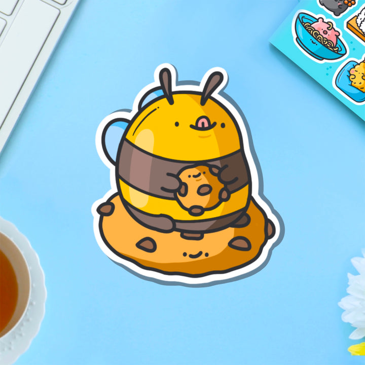 Cookie Bee Vinyl Sticker on blue table