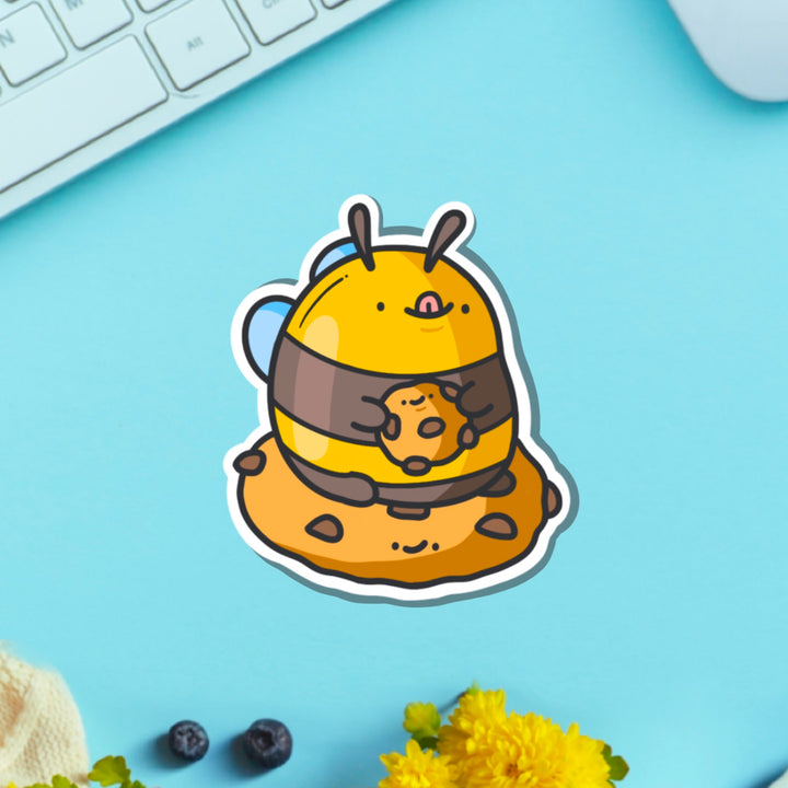 Cookie Bee Vinyl Sticker on blue table with keyboard