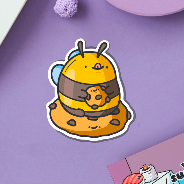 Cookie Bee Vinyl Sticker on purple table