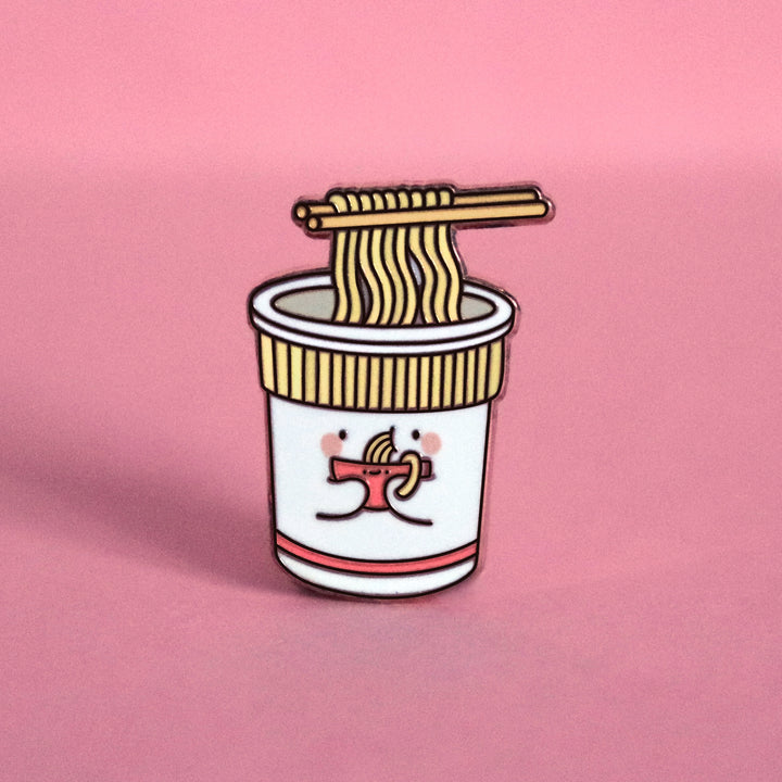 Cup noodles eating bowl of noodles enamel pin on pink table