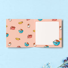 Curry print inside card on blue table