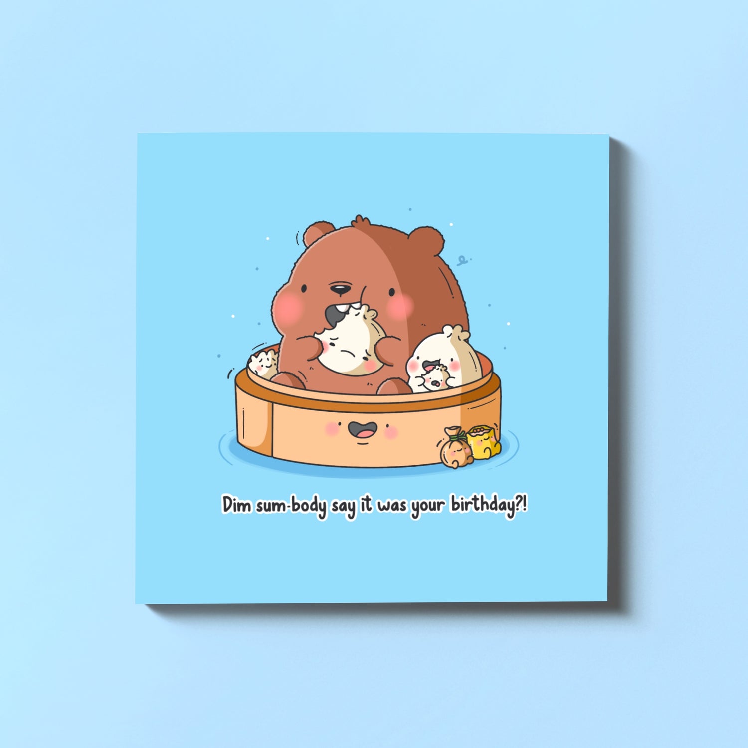 Dim sum bear birthday card on blue table