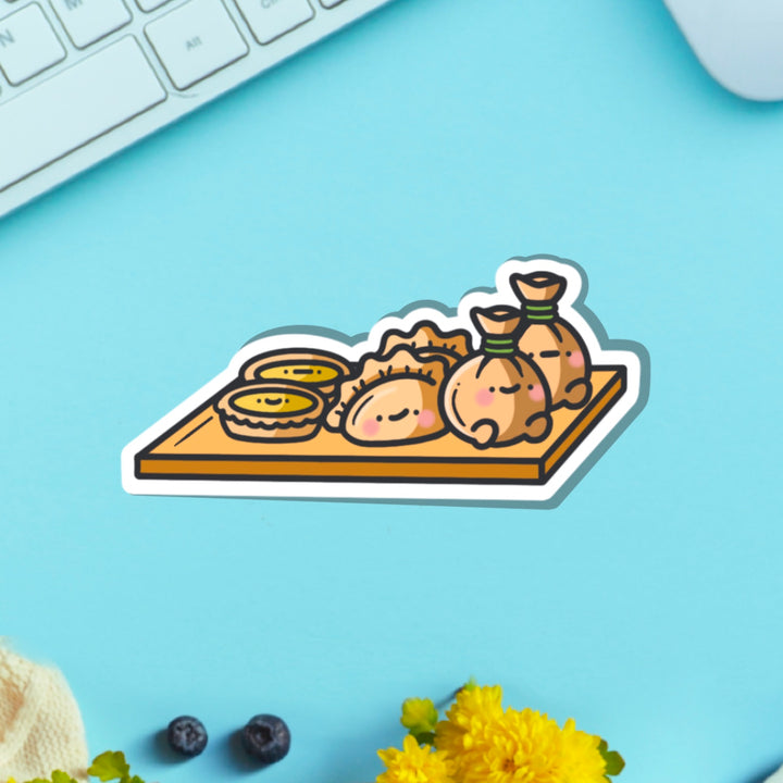 Dim sum vinyl sticker on blue table with keyboard