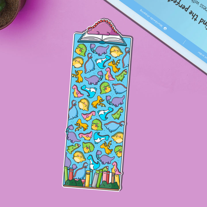 Dinosaur bookmark on purple table