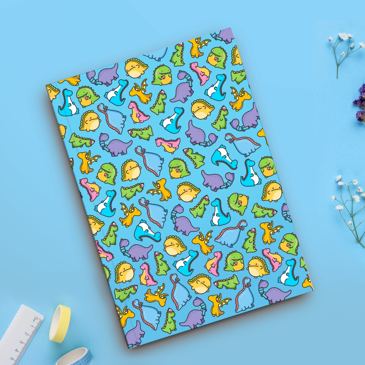 Dinosaur notebook on blue table