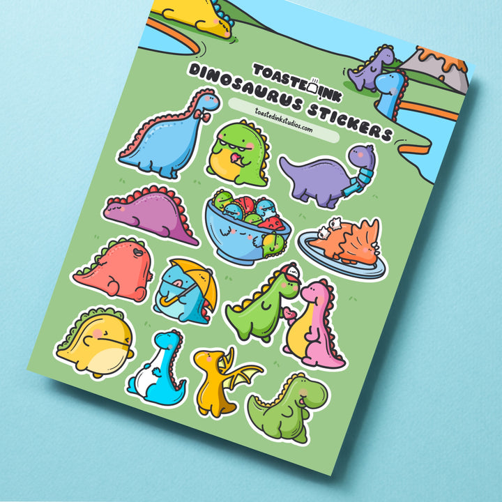 Dinosaur sticker sheet on turquoise table