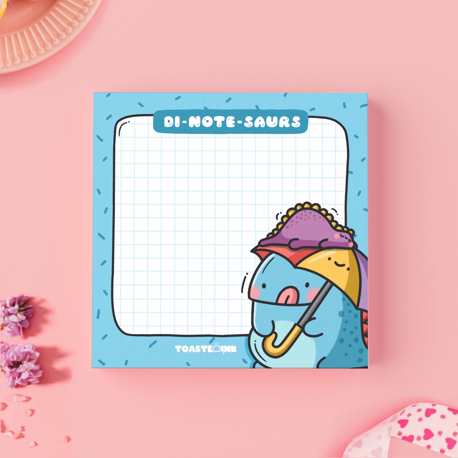 Dinosaur sticky notes on pink table