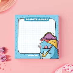 Dinosaur sticky notes on pink table