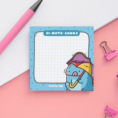 Dinosaur sticky notes on pink and white table