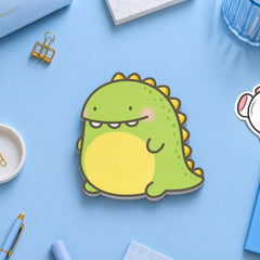Dinosaur sticky notes on blue table with stationery