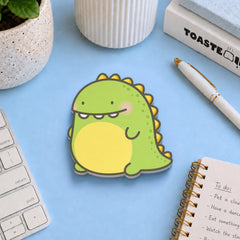 Dinosaur sticky notes on blue desk with stationery
