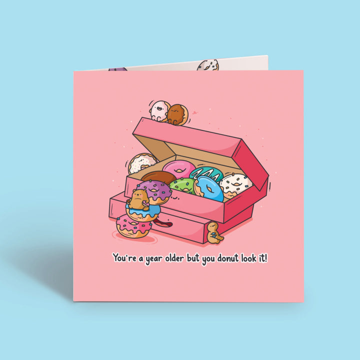 Donut card on blue desk