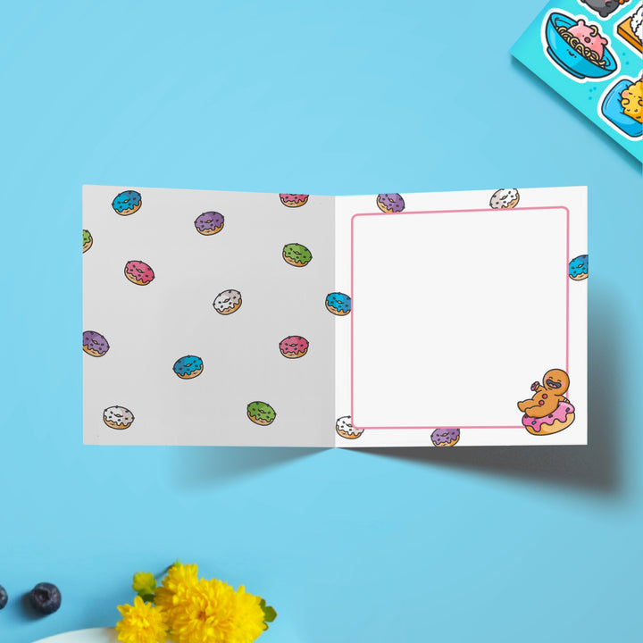 Donut print inside card on blue table