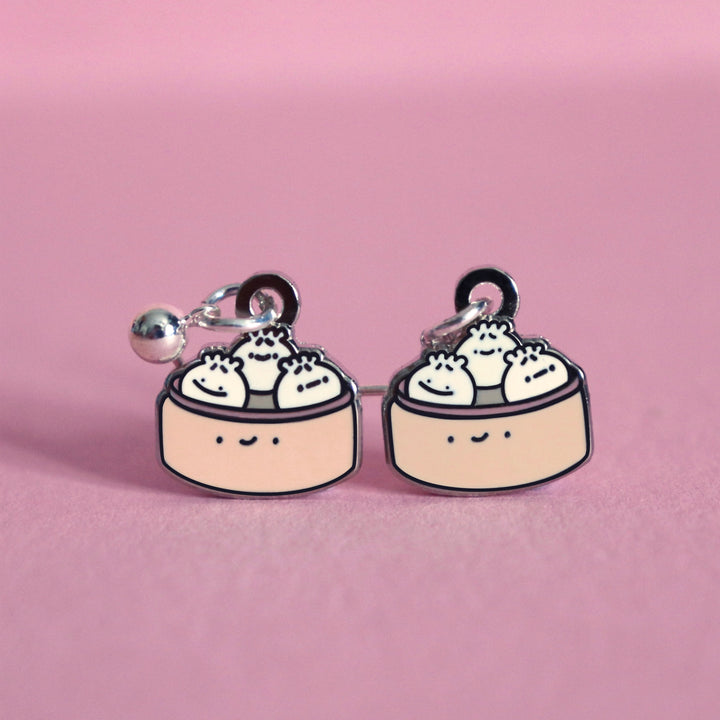 Dumpling earrings on pink table