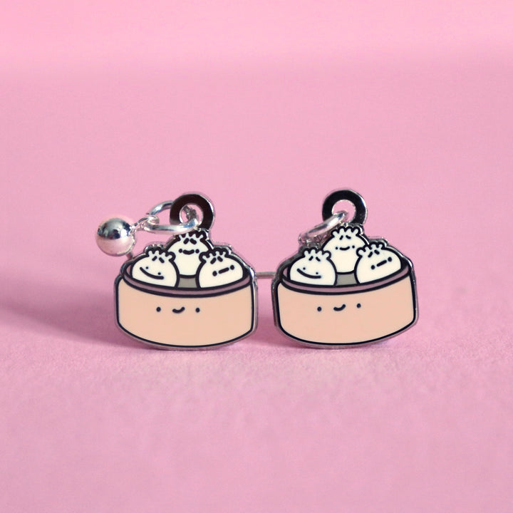 Dumpling earrings on pink table