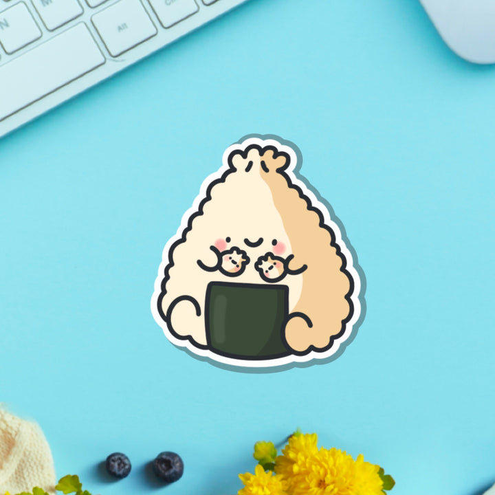 Dumpling sushi vinyl sticker on blue table with keyboard