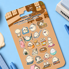 Dumpling sticker sheet on blue desk with stationery