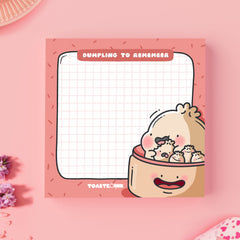 Dumpling sticky notes on pink desk