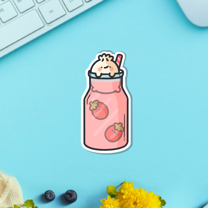 Dumpling in strawberry milkshake vinyl sticker on green table