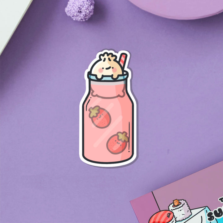 Dumpling in strawberry milkshake vinyl sticker on purple table