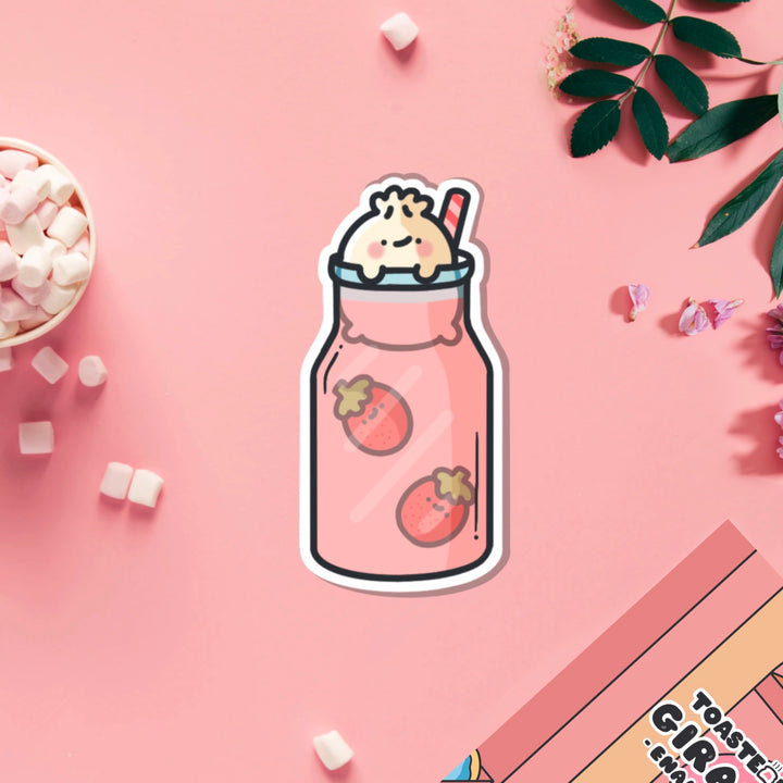 Dumpling in strawberry milkshake vinyl sticker on pink table